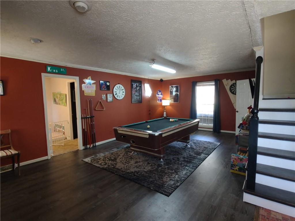 23 The Trail Southeast Lindale, GA 30147 - Photo 14 of 37 a living room with furniture flat screen tv and a wooden floor