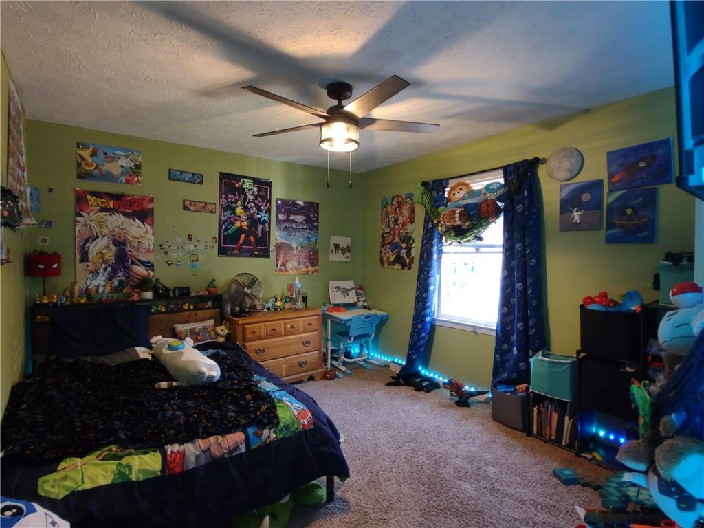 23 The Trail Southeast Lindale, GA 30147 - Photo 19 of 37 a bed room with furniture and a window