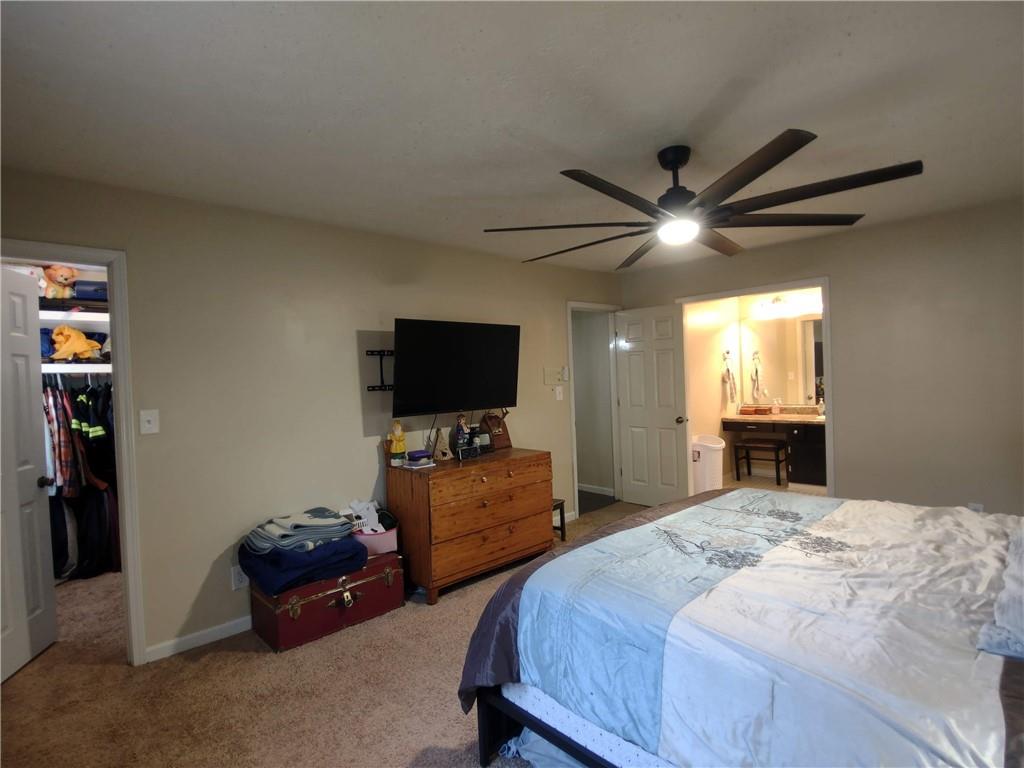 23 The Trail Southeast Lindale, GA 30147 - Photo 22 of 37 a bedroom with a bed and a flat screen tv
