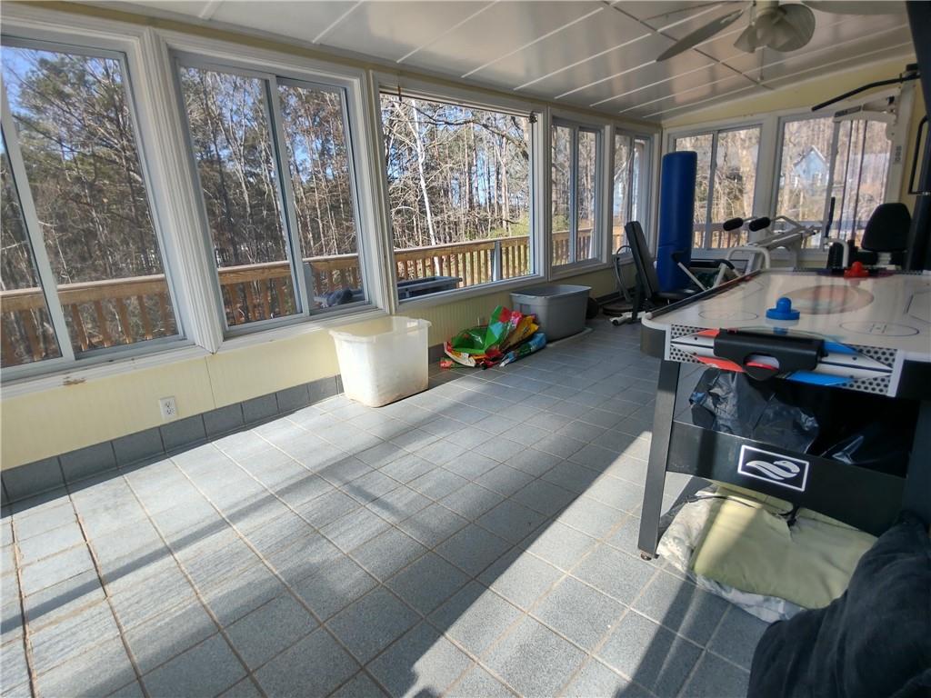 23 The Trail Southeast Lindale, GA 30147 - Photo 26 of 37 a living room with furniture and large windows