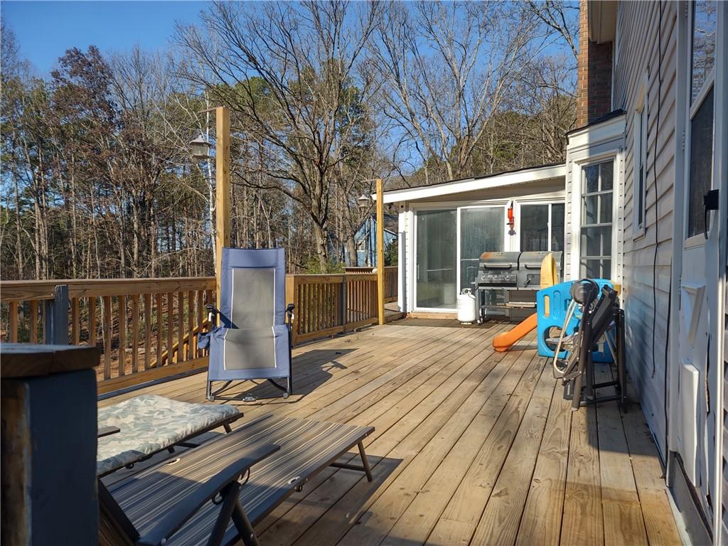 23 The Trail Southeast Lindale, GA 30147 - Photo 29 of 37 a view of a deck with wooden floor and outdoor seating