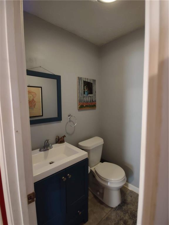 23 The Trail Southeast Lindale, GA 30147 - Photo 9 of 37 a bathroom with a toilet sink and mirror