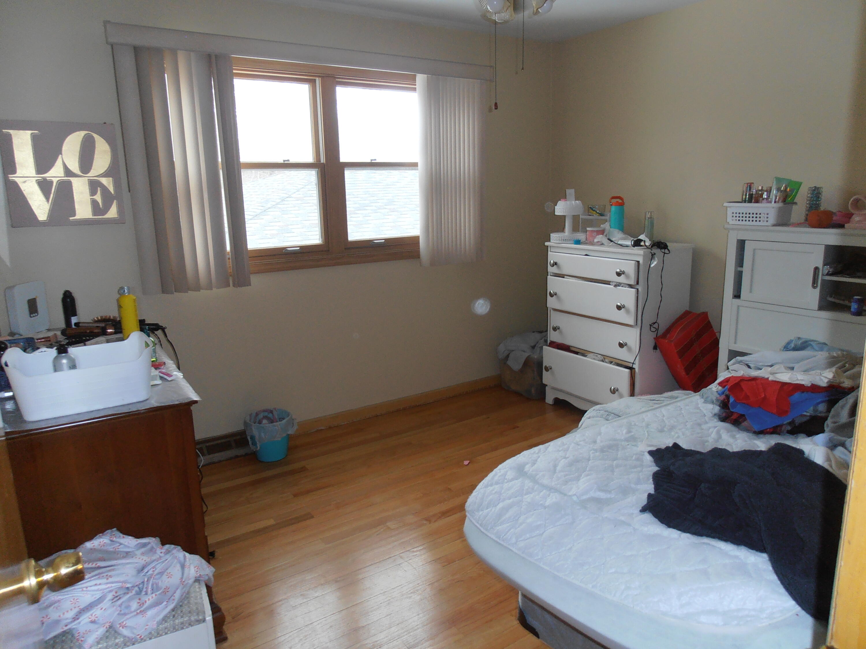 3341 Martha Street Highland, IN 46322 - Photo 5 of 8 a bedroom with a bed and a window