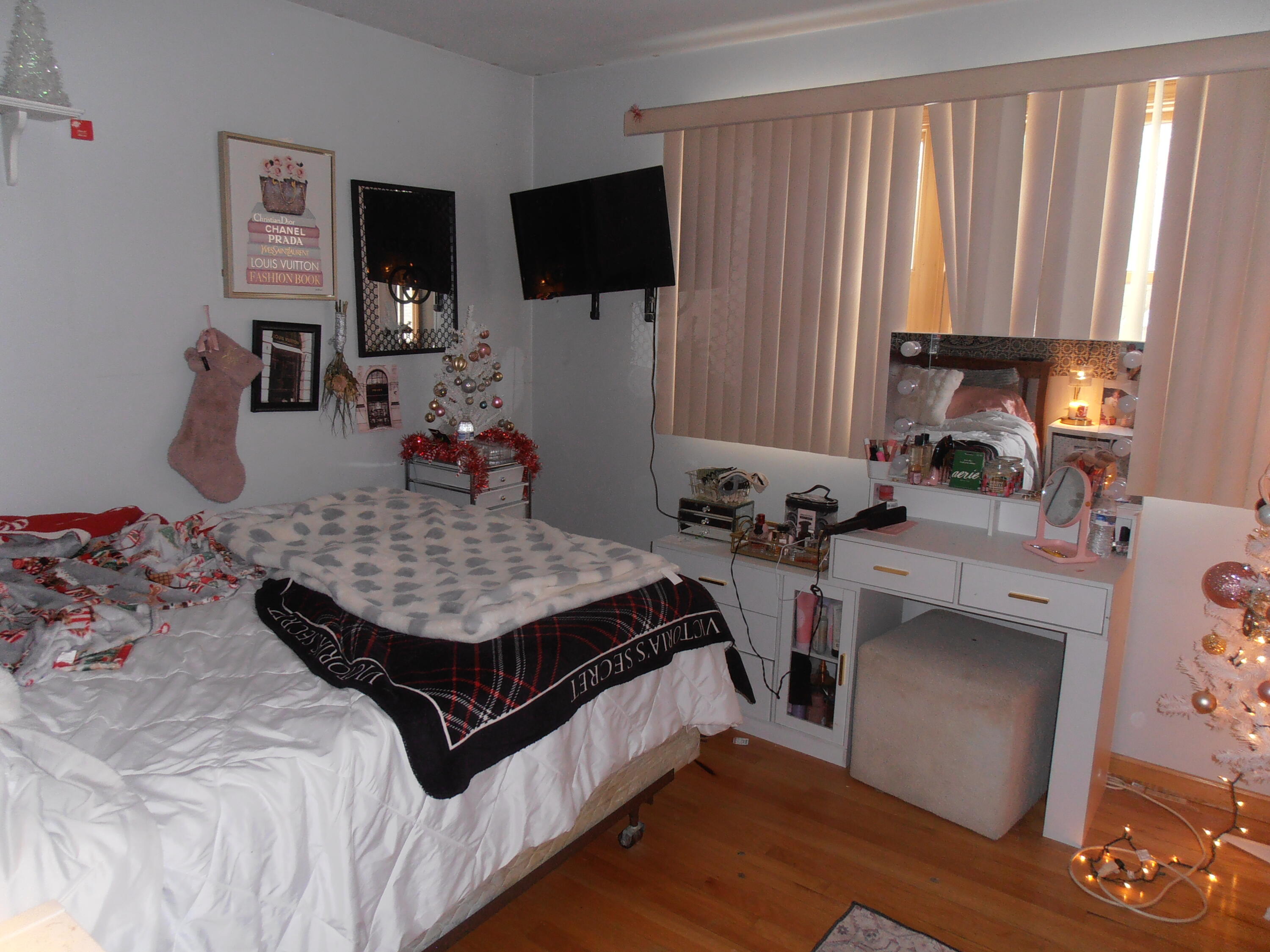 3341 Martha Street Highland, IN 46322 - Photo 6 of 8 a bedroom with a bed window and a flat screen tv