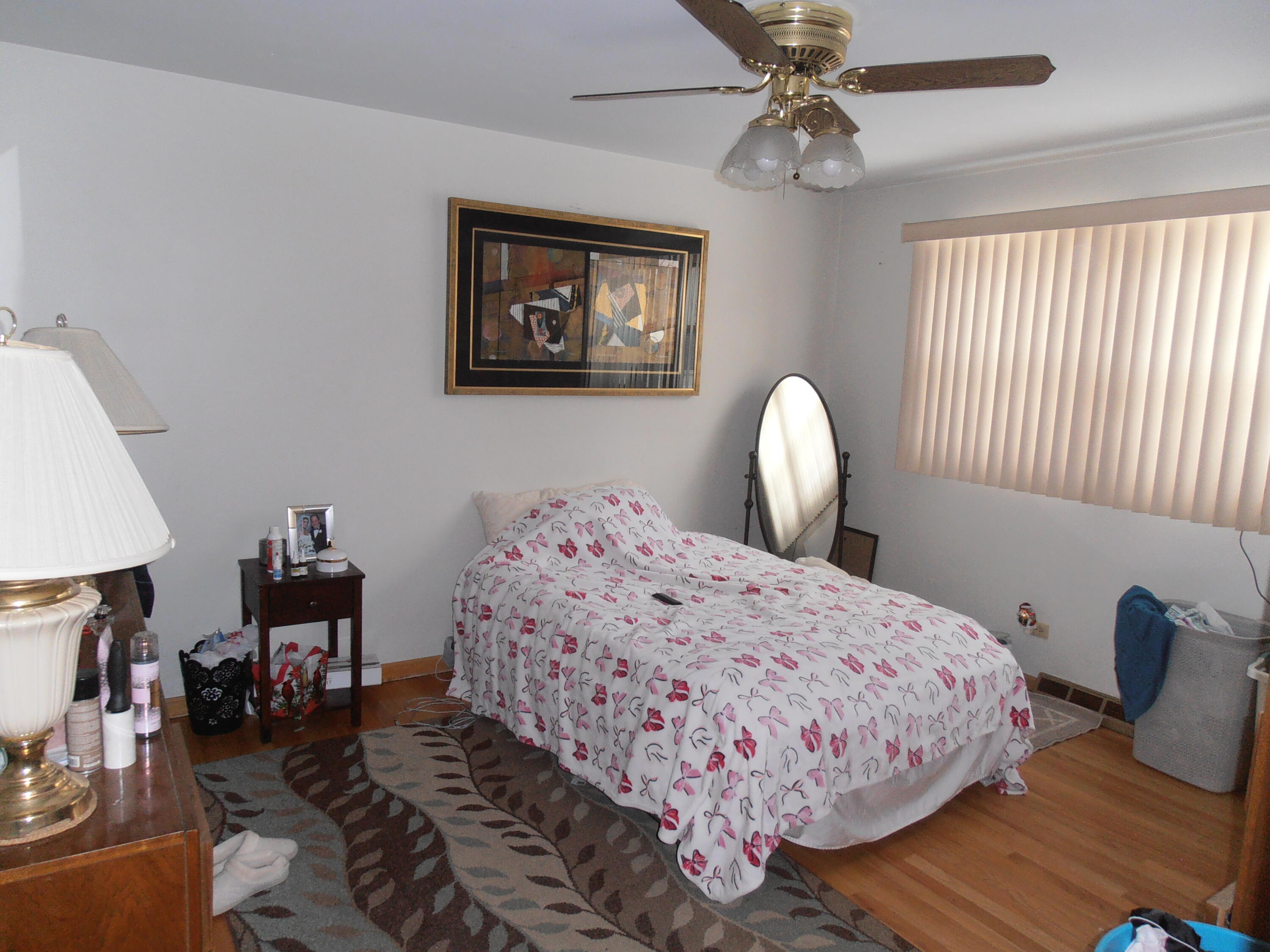3341 Martha Street Highland, IN 46322 - Photo 7 of 8 a bedroom with bed and a window