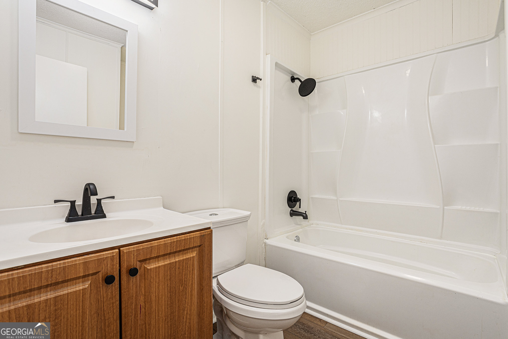 1113 Lake View Drive Jonesboro, GA 30236 - Photo 15 of 25 a bathroom with a sink a toilet and shower
