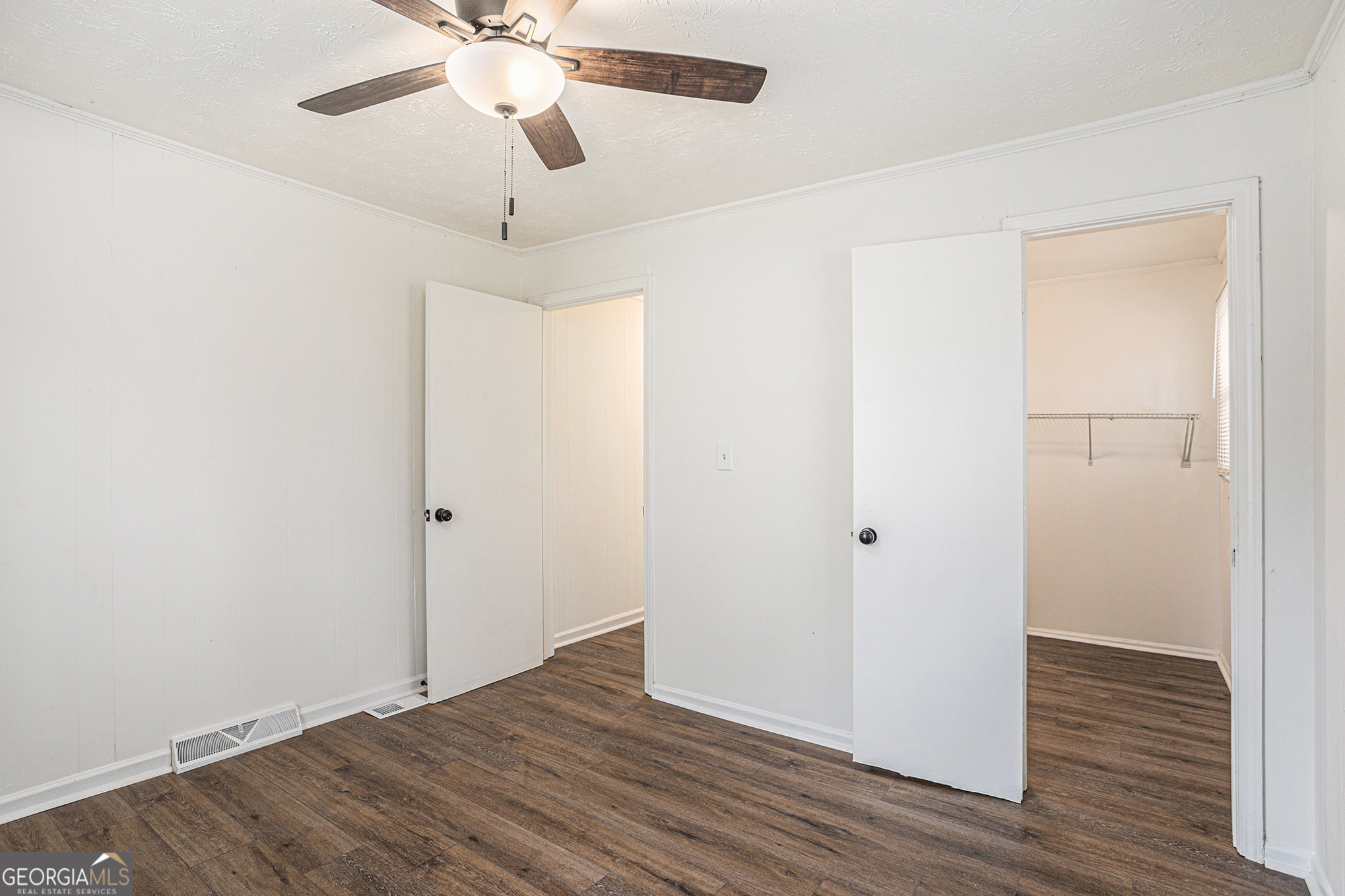 1113 Lake View Drive Jonesboro, GA 30236 - Photo 17 of 25 a view of an empty room with wooden floor
