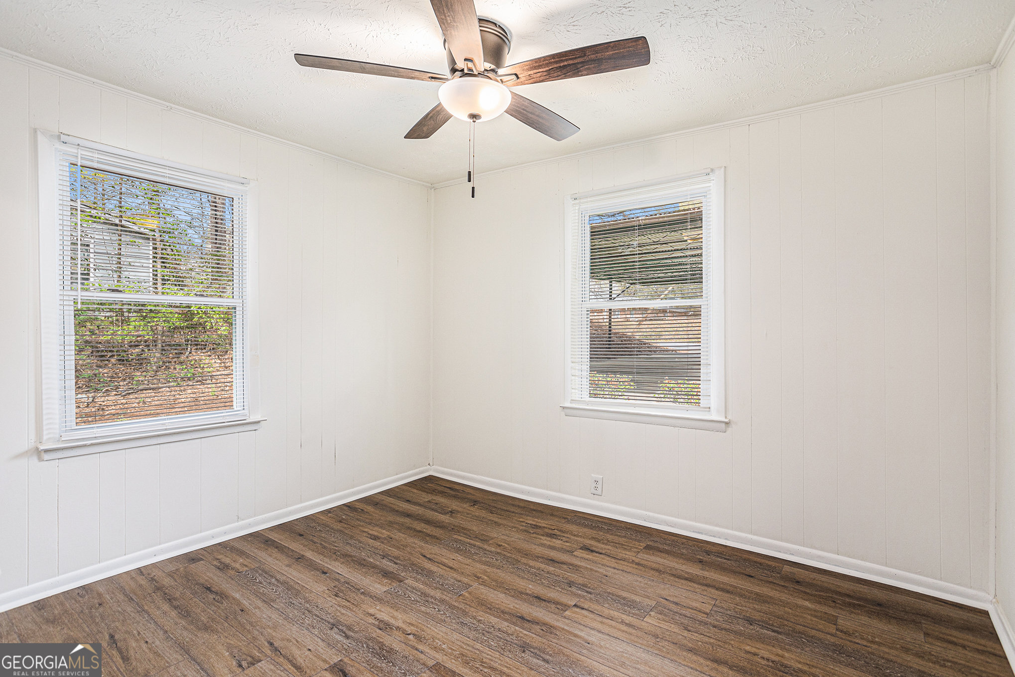 1113 Lake View Drive Jonesboro, GA 30236 - Photo 19 of 25 a view of an empty room with wooden floor and a window