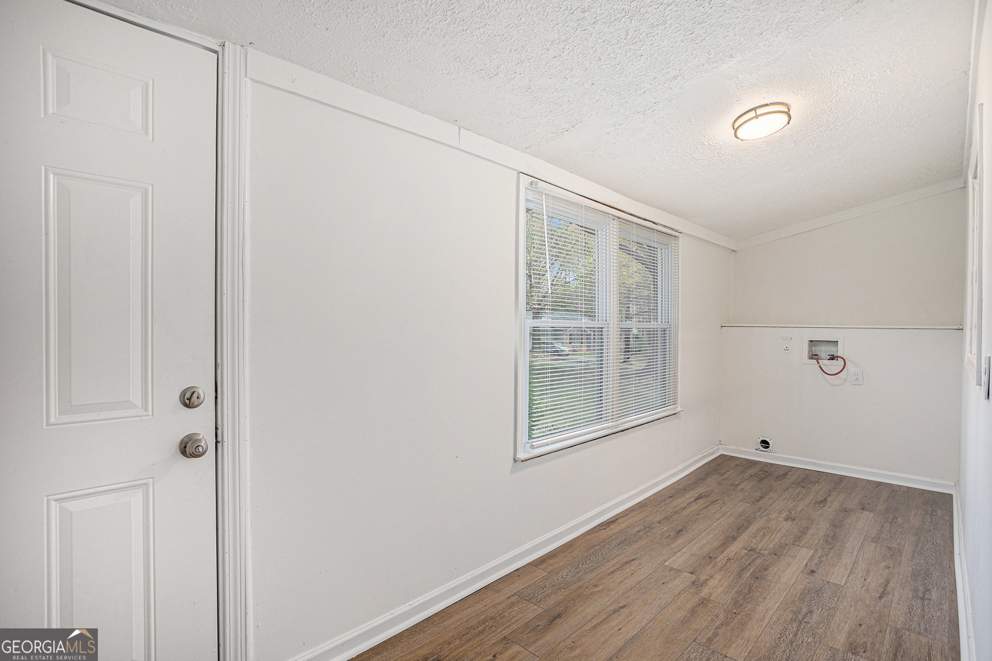 1113 Lake View Drive Jonesboro, GA 30236 - Photo 9 of 25 a view of empty room with wooden floor and fan