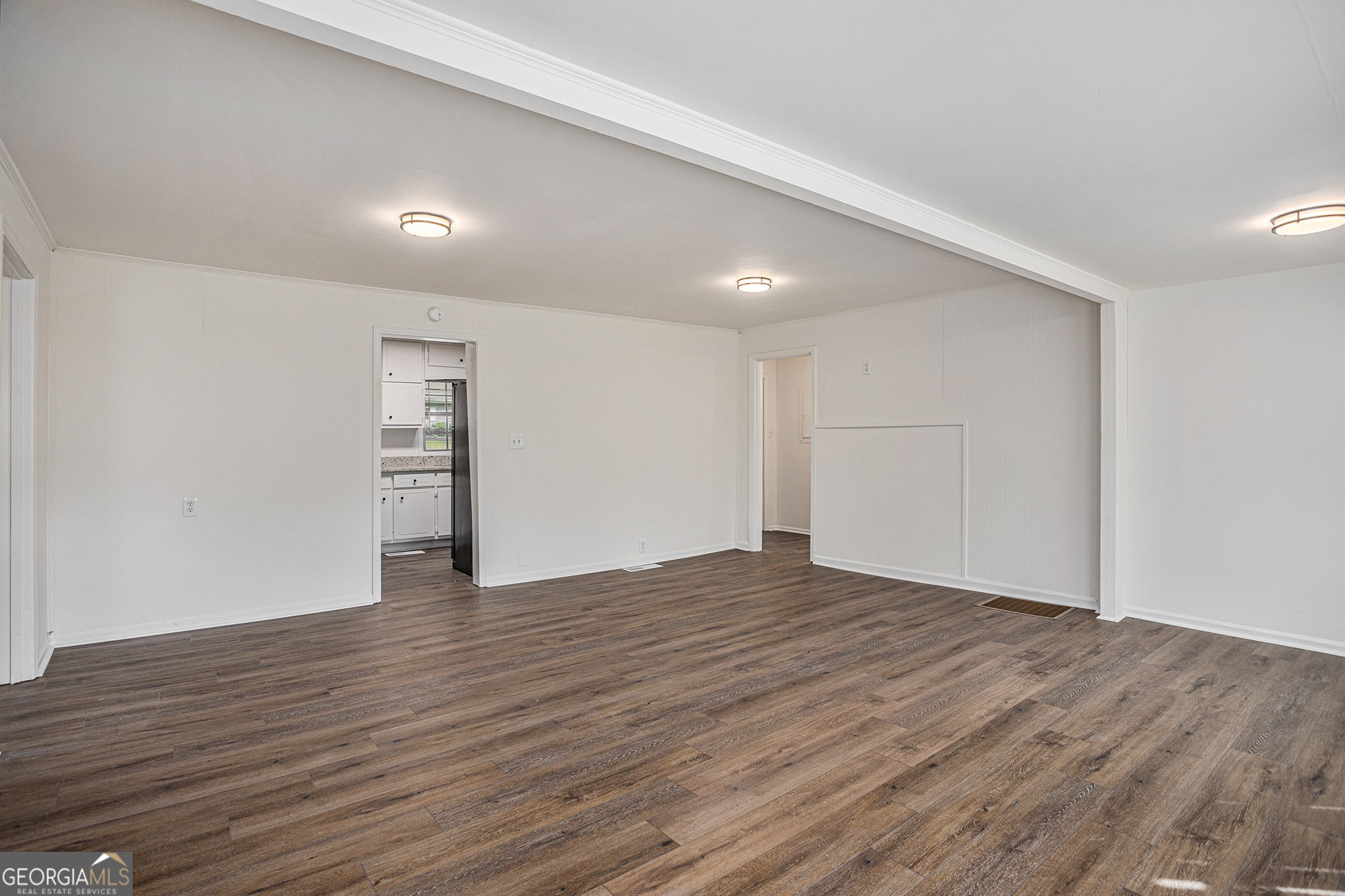 1113 Lake View Drive Jonesboro, GA 30236 - Photo 10 of 25 a view of an empty room with wooden floor