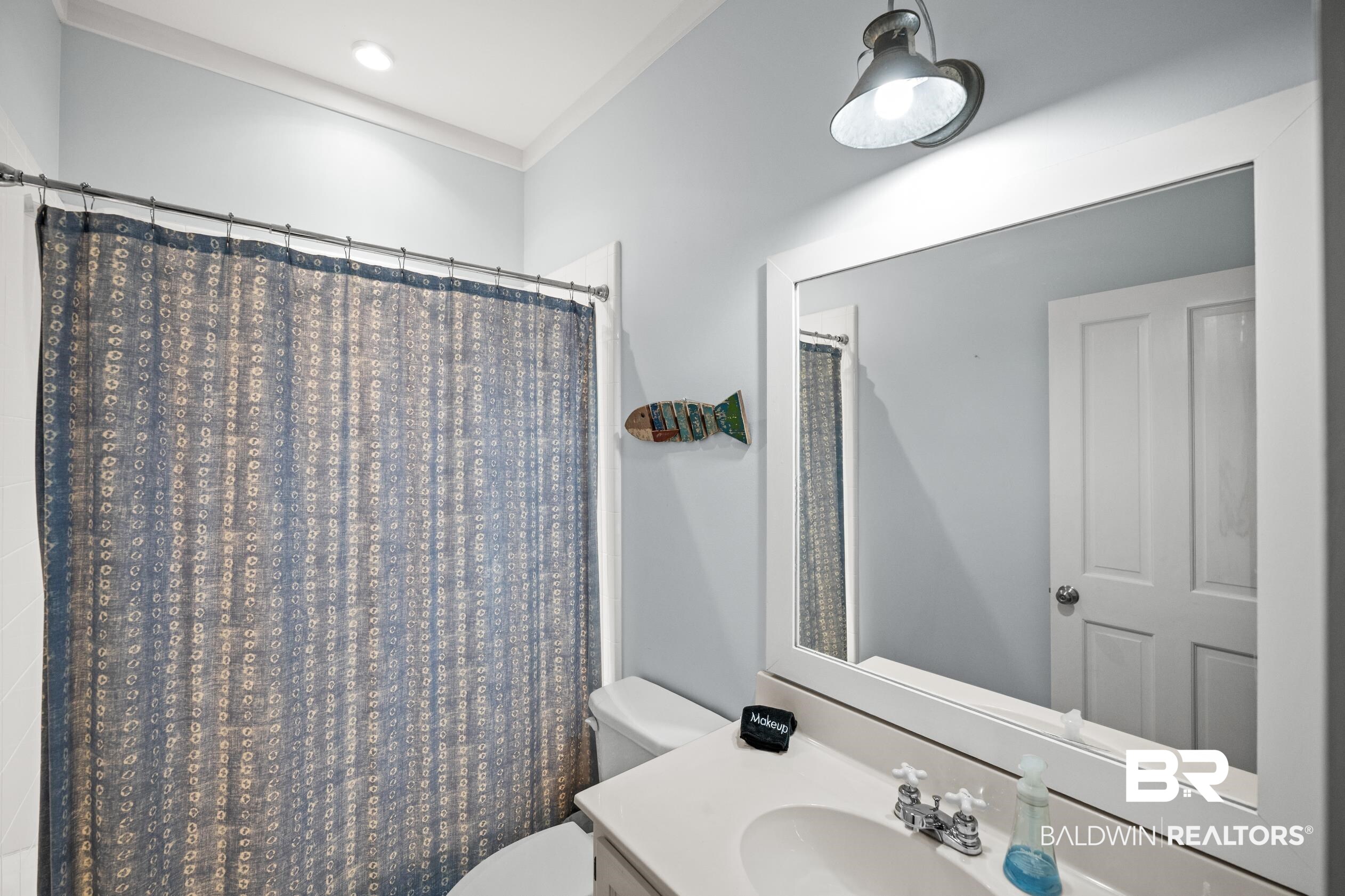 25773 Canal Road, Unit 28 Orange Beach, AL 36561 - Photo 26 of 48 Bathroom featuring curtained shower and vanity