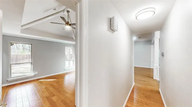 a view of a hallway with windows