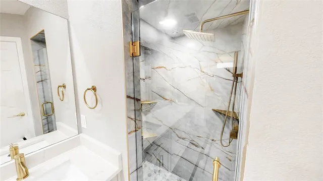 a bathroom with a bathtub and shower