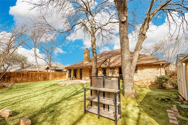 a view of a yard with swimming pool