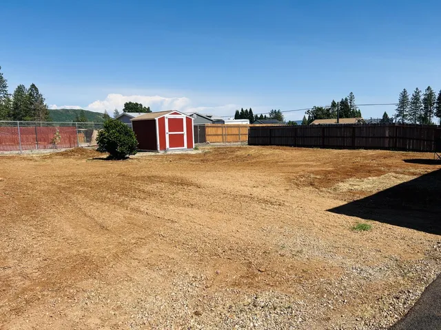 a view of a pool with a yard