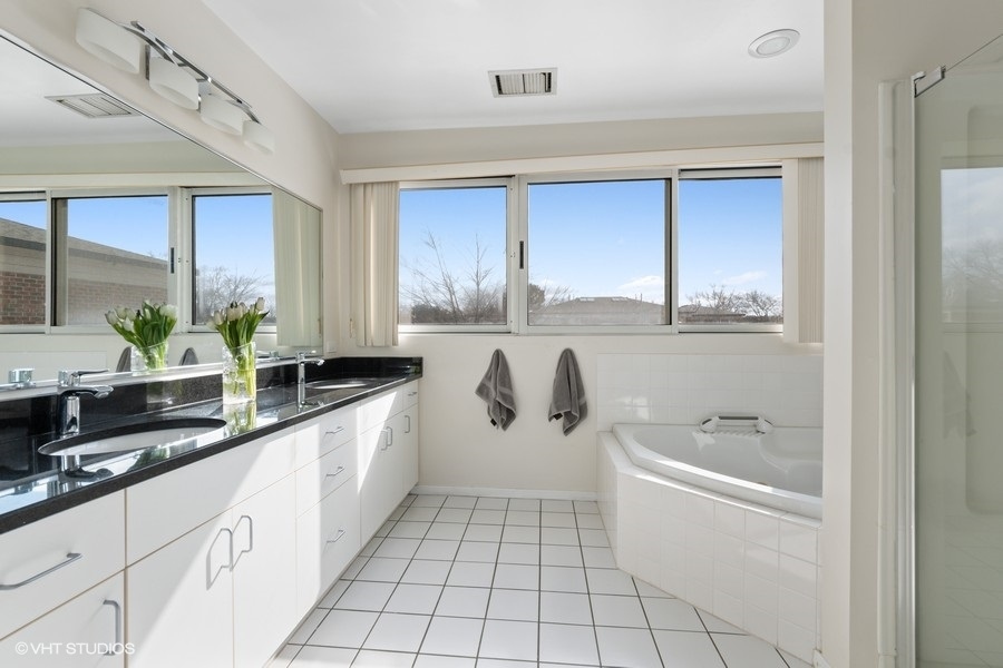 378 Milford Road Deerfield, IL 60015 - Photo 11 of 22 a large white kitchen with a large window