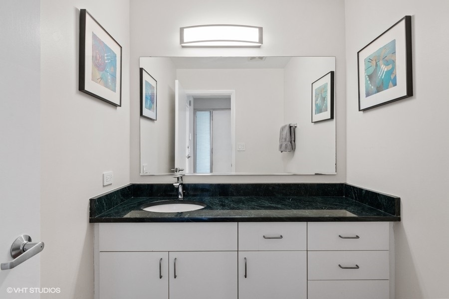 378 Milford Road Deerfield, IL 60015 - Photo 9 of 22 a bathroom with a sink and a mirror