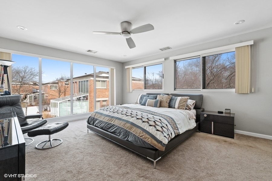 378 Milford Road Deerfield, IL 60015 - Photo 10 of 22 a spacious bedroom with a bed a table and large window