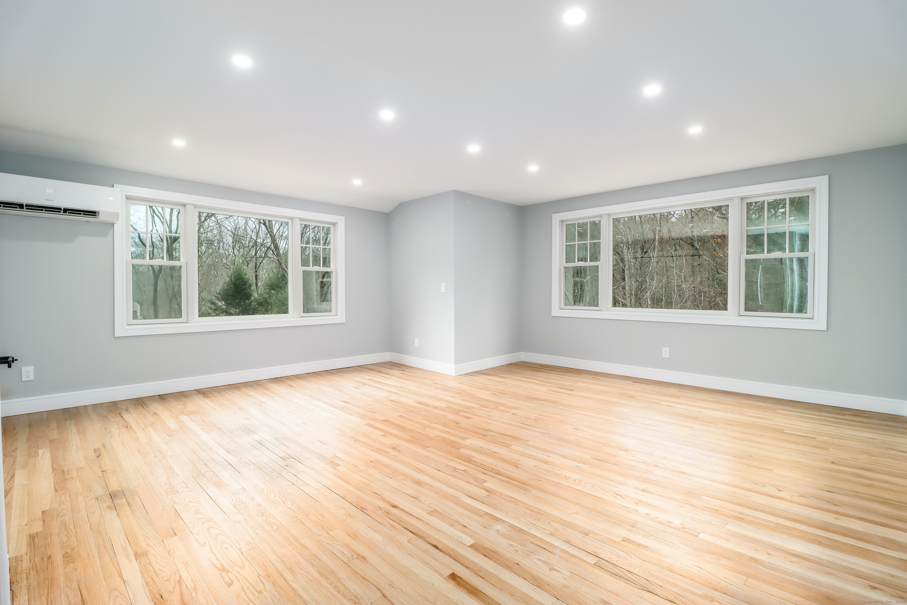 5 Antler Pine Road Newtown, CT 06482 - Photo 18 of 38 a view of an empty room with wooden floor and a window