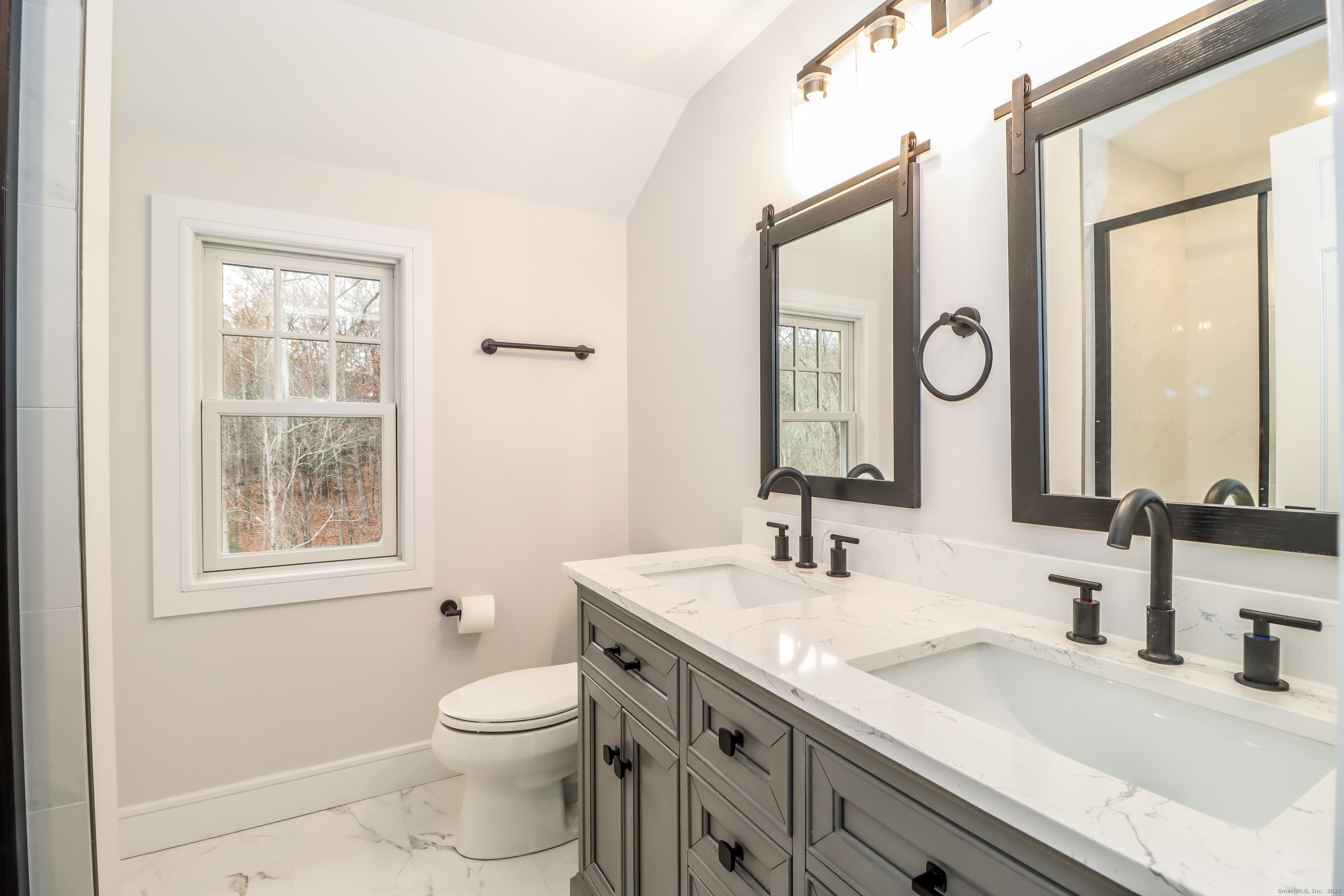 5 Antler Pine Road Newtown, CT 06482 - Photo 21 of 38 a bathroom with a granite countertop toilet sink and a mirror