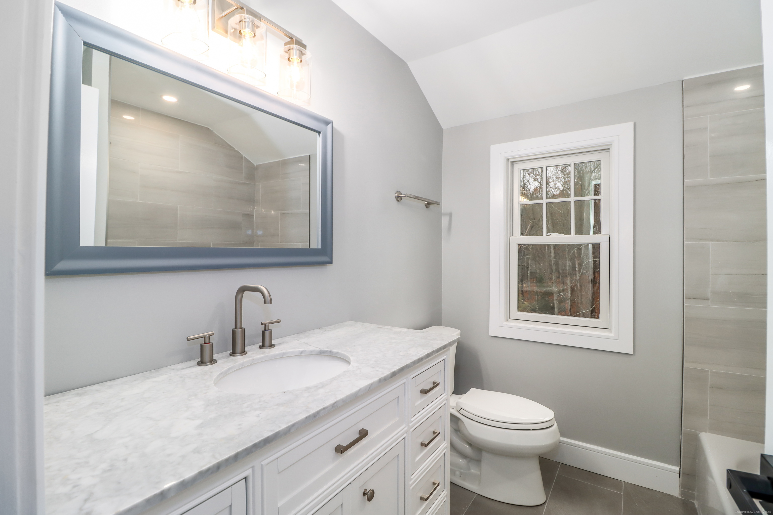 5 Antler Pine Road Newtown, CT 06482 - Photo 25 of 38 a bathroom with a toilet sink vanity and mirror