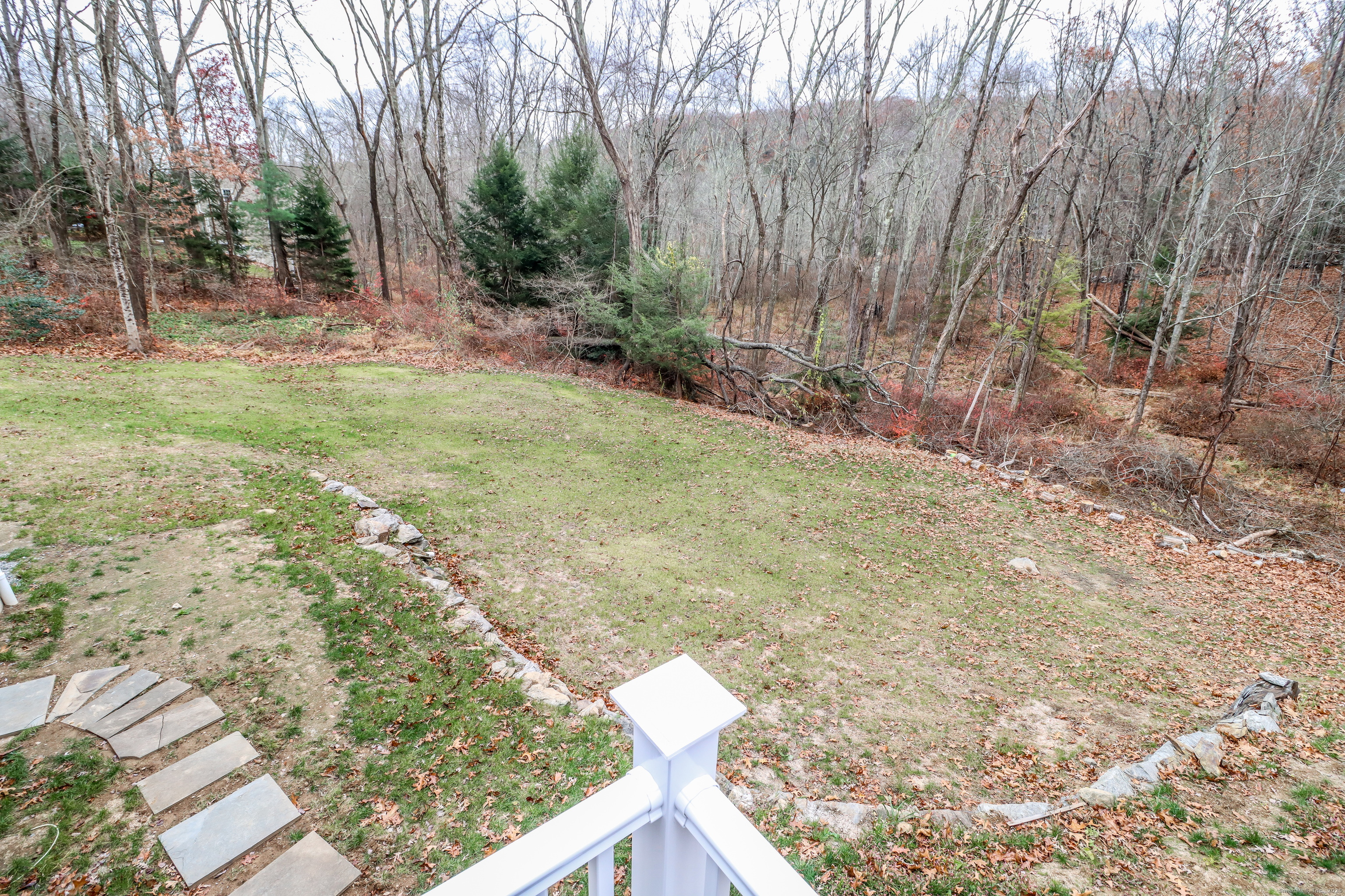 5 Antler Pine Road Newtown, CT 06482 - Photo 29 of 38 a backyard of a house with lots of green space