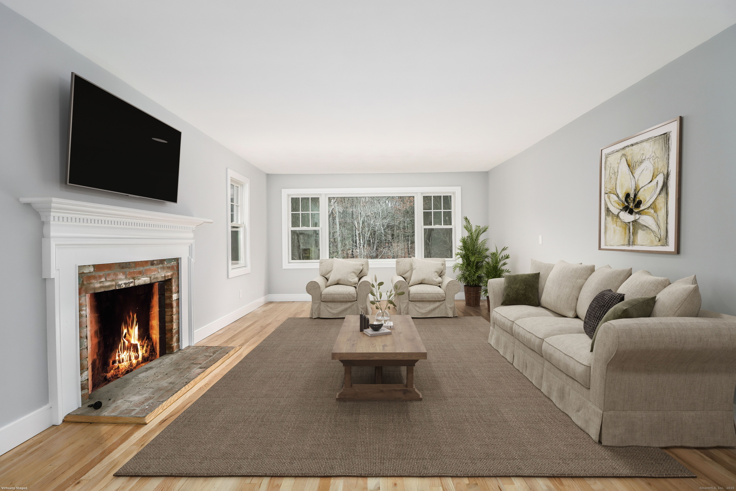 5 Antler Pine Road Newtown, CT 06482 - Photo 5 of 38 a living room with furniture a fireplace and a flat screen tv