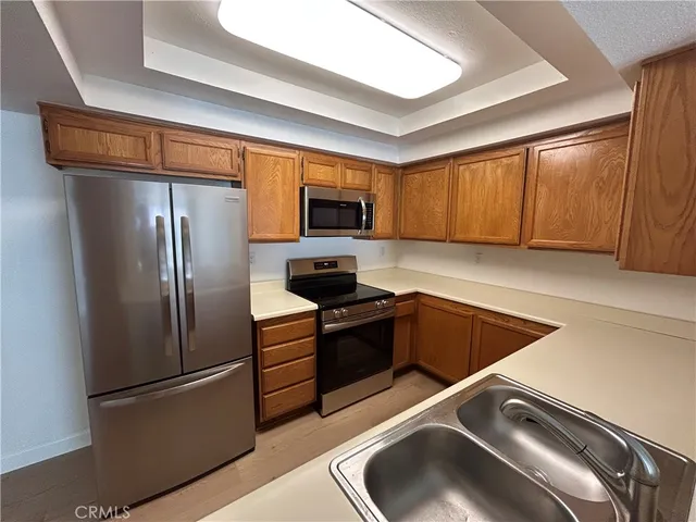 a kitchen with a refrigerator sink and microwave