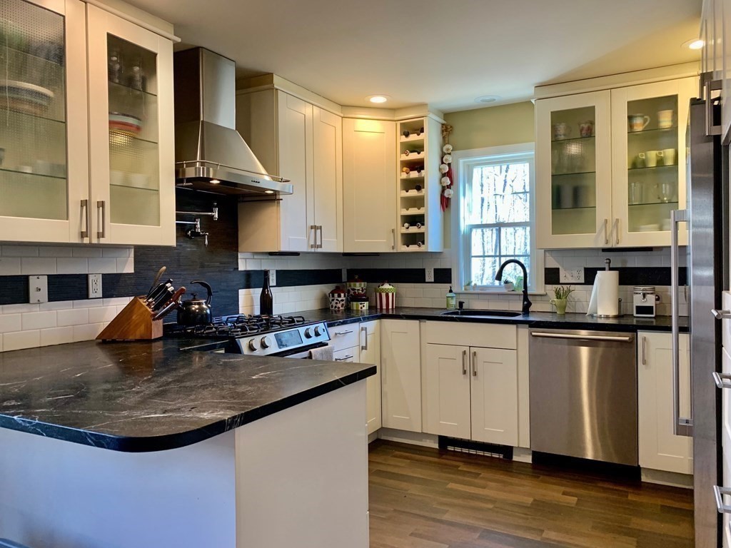 696 Florence Road Northampton, MA 01062 - Photo 11 of 35 a kitchen with sink a window and chairs