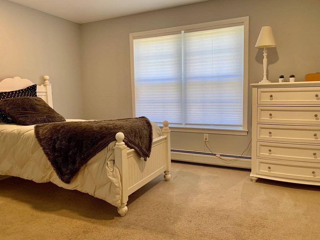 696 Florence Road Northampton, MA 01062 - Photo 17 of 35 a spacious bedroom with a bed and a dresser