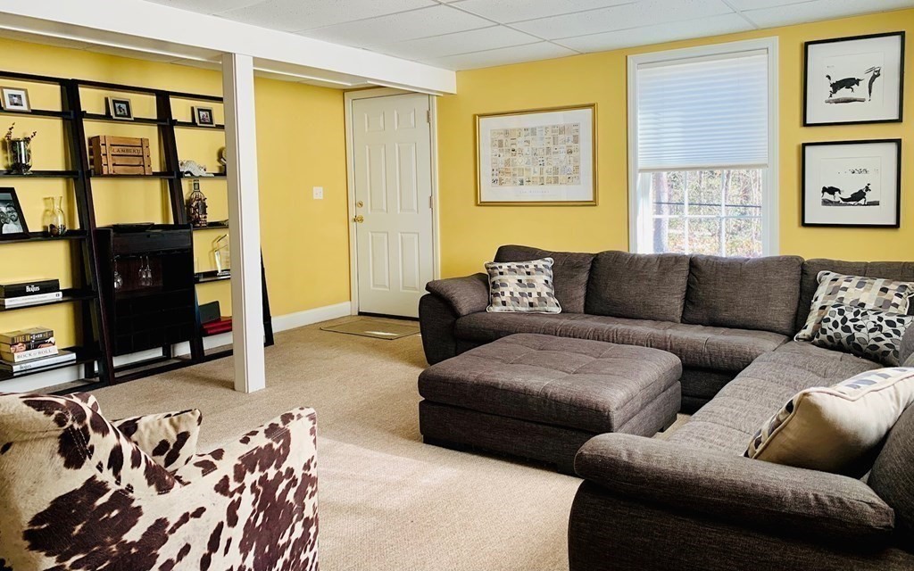 696 Florence Road Northampton, MA 01062 - Photo 22 of 35 a living room with furniture and a flat screen tv