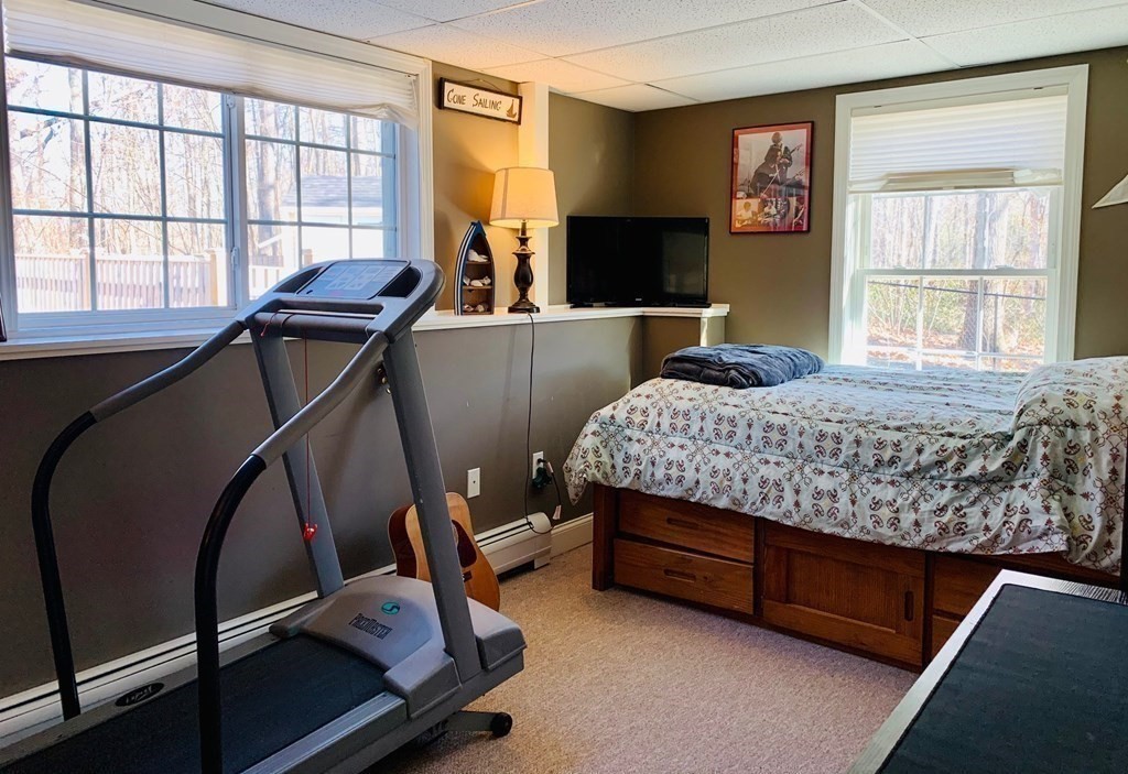 696 Florence Road Northampton, MA 01062 - Photo 24 of 35 a bedroom with a bed and large windows