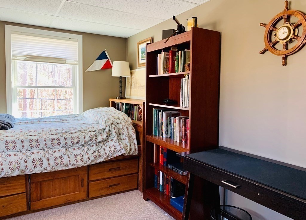 696 Florence Road Northampton, MA 01062 - Photo 25 of 35 a bedroom with furniture and a book shelf
