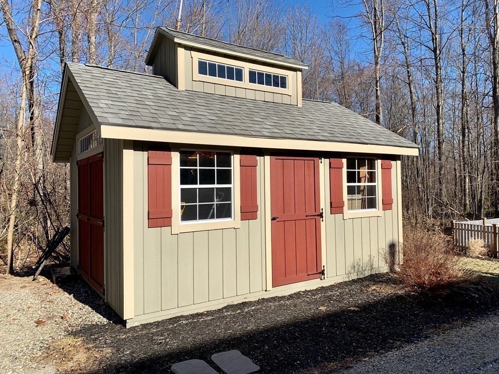 696 Florence Road Northampton, MA 01062 - Photo 33 of 35 a front view of a house with a yard