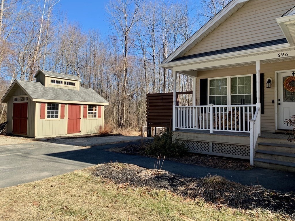 696 Florence Road Northampton, MA 01062 - Photo 34 of 35 a front view of a house with a yard