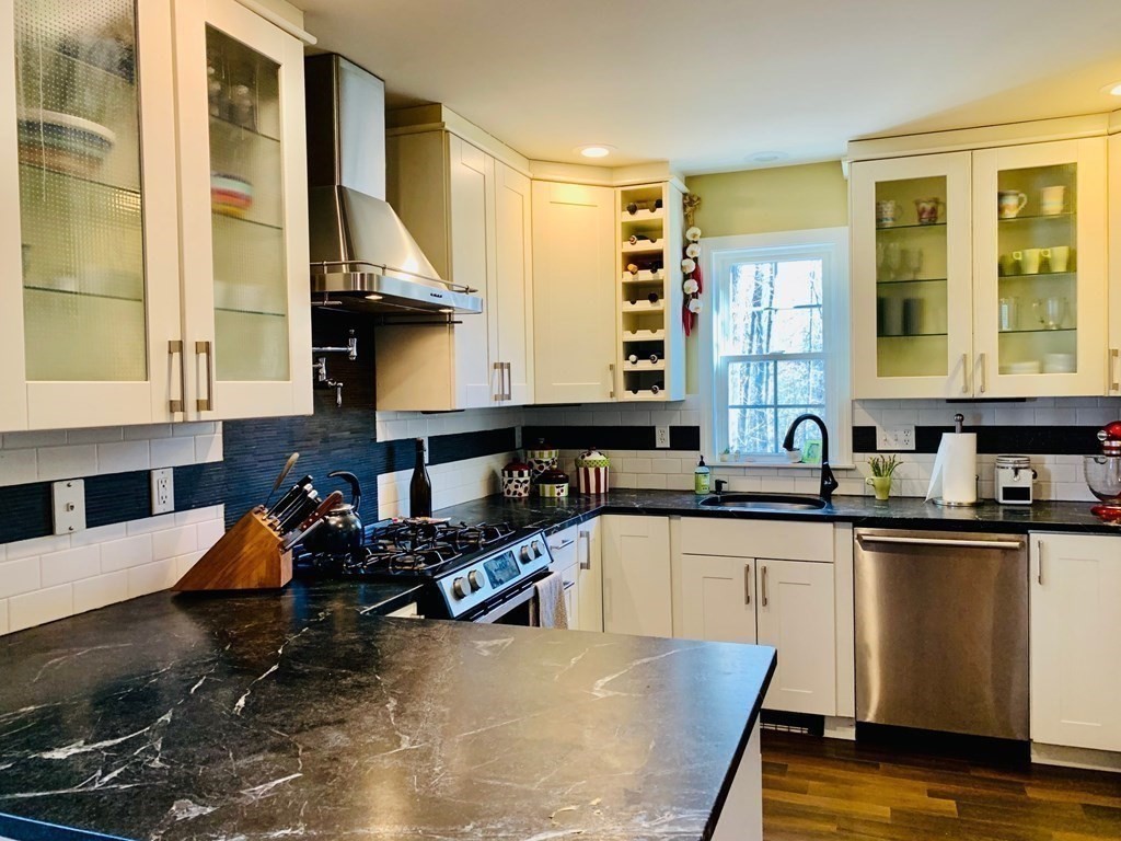 696 Florence Road Northampton, MA 01062 - Photo 9 of 35 a kitchen that has a sink and chairs in it