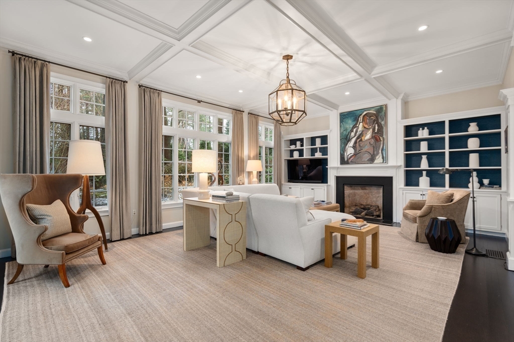 48 Scotch Pine Road Wellesley, MA 02481 - Photo 11 of 39 a living room with furniture a fireplace and a chandelier