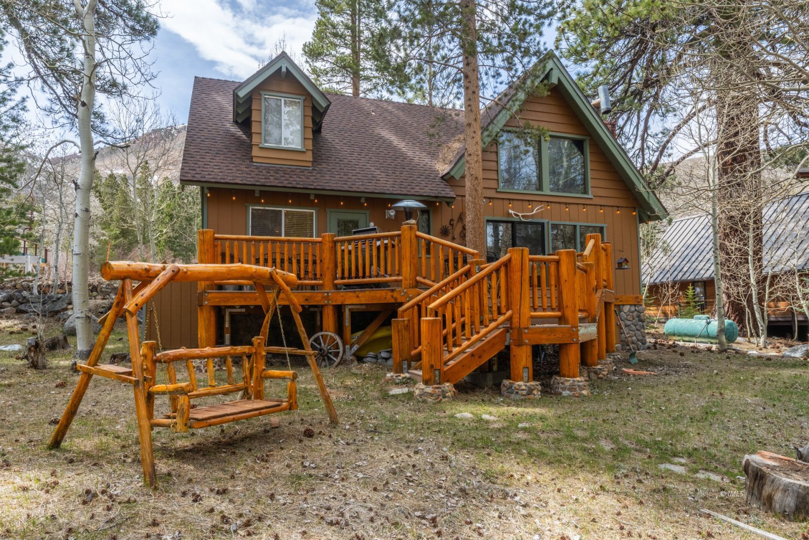 234 Brook Lane Bishop, CA 93514 - Photo 7 of 33 a view of a house with a yard chairs and wooden fence