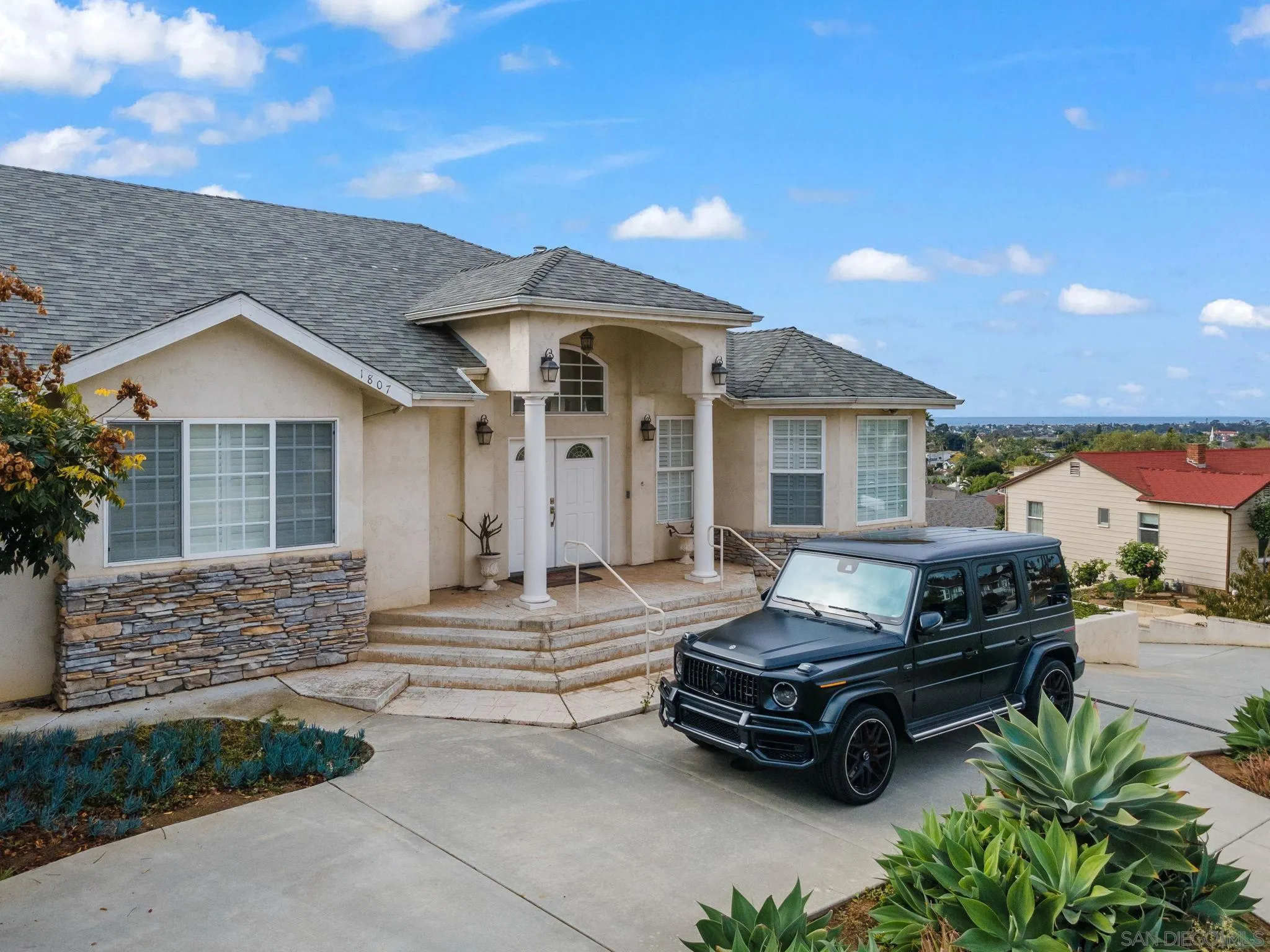 1807 Laurel Road Oceanside, CA 92054 - Photo 20 of 67 a car parked in front of a house