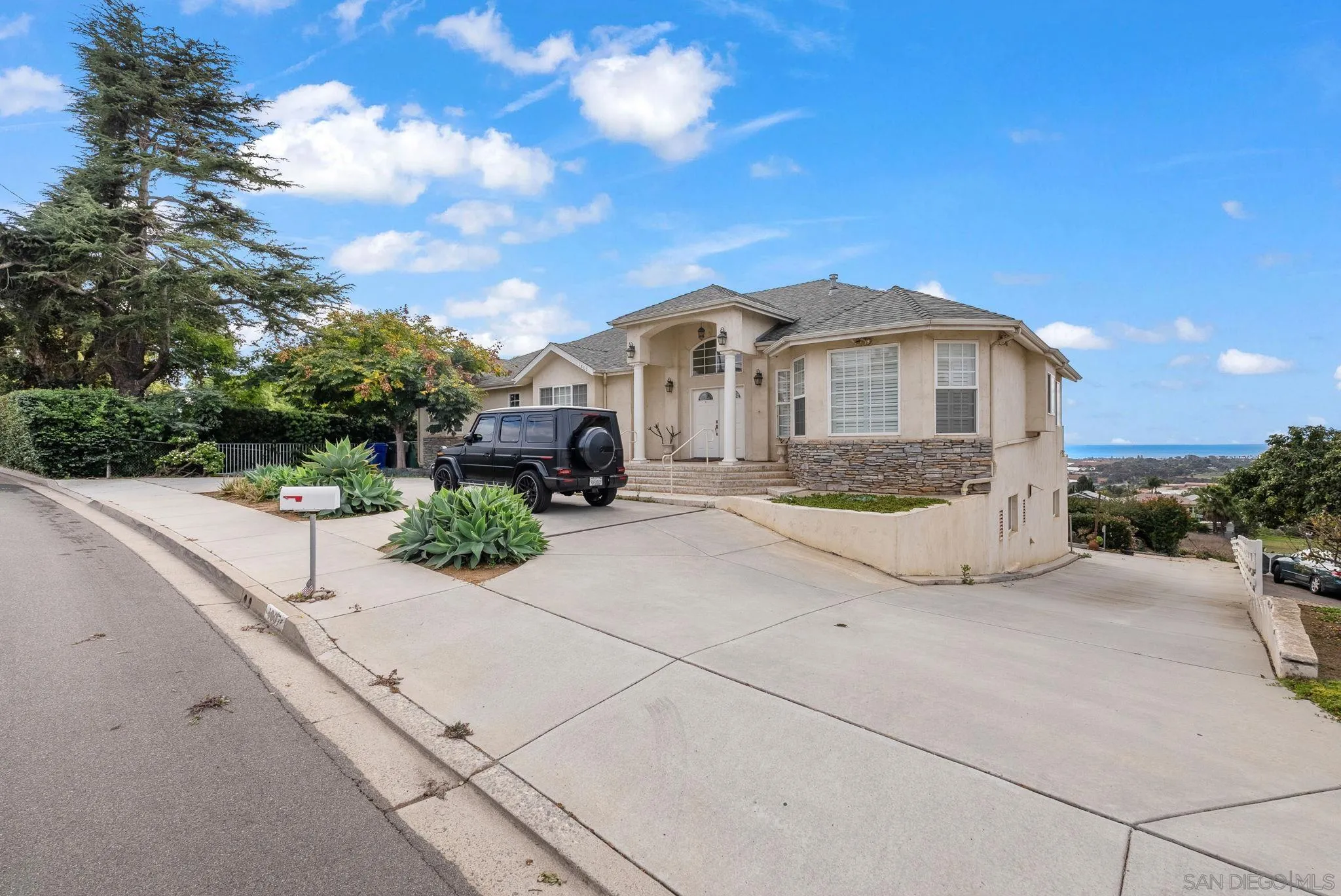 1807 Laurel Road Oceanside, CA 92054 - Photo 22 of 67 a front view of a house with a yard and potted plants