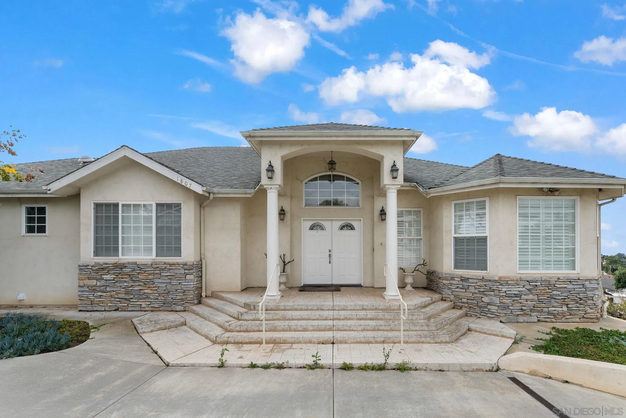 1807 Laurel Road Oceanside, CA 92054 - Photo 25 of 67 a front view of a house with a yard