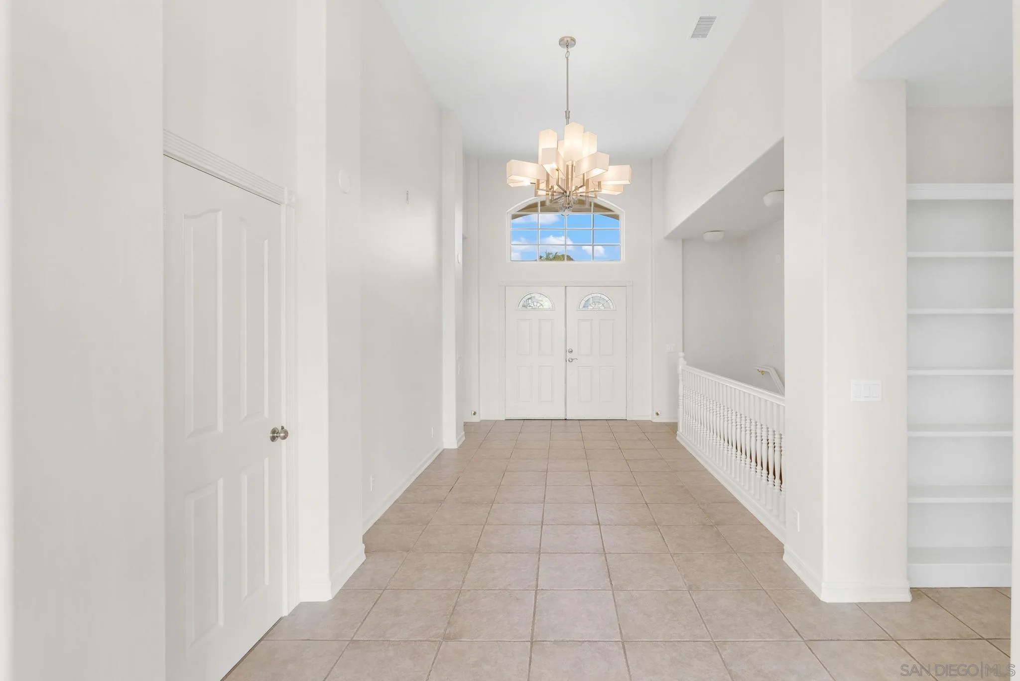 1807 Laurel Road Oceanside, CA 92054 - Photo 35 of 67 a view of a hallway with a chandelier