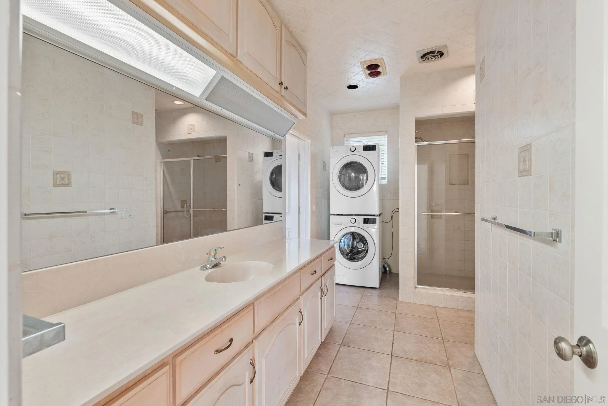 1807 Laurel Road Oceanside, CA 92054 - Photo 45 of 67 a spacious bathroom with a sink a toilet and shower