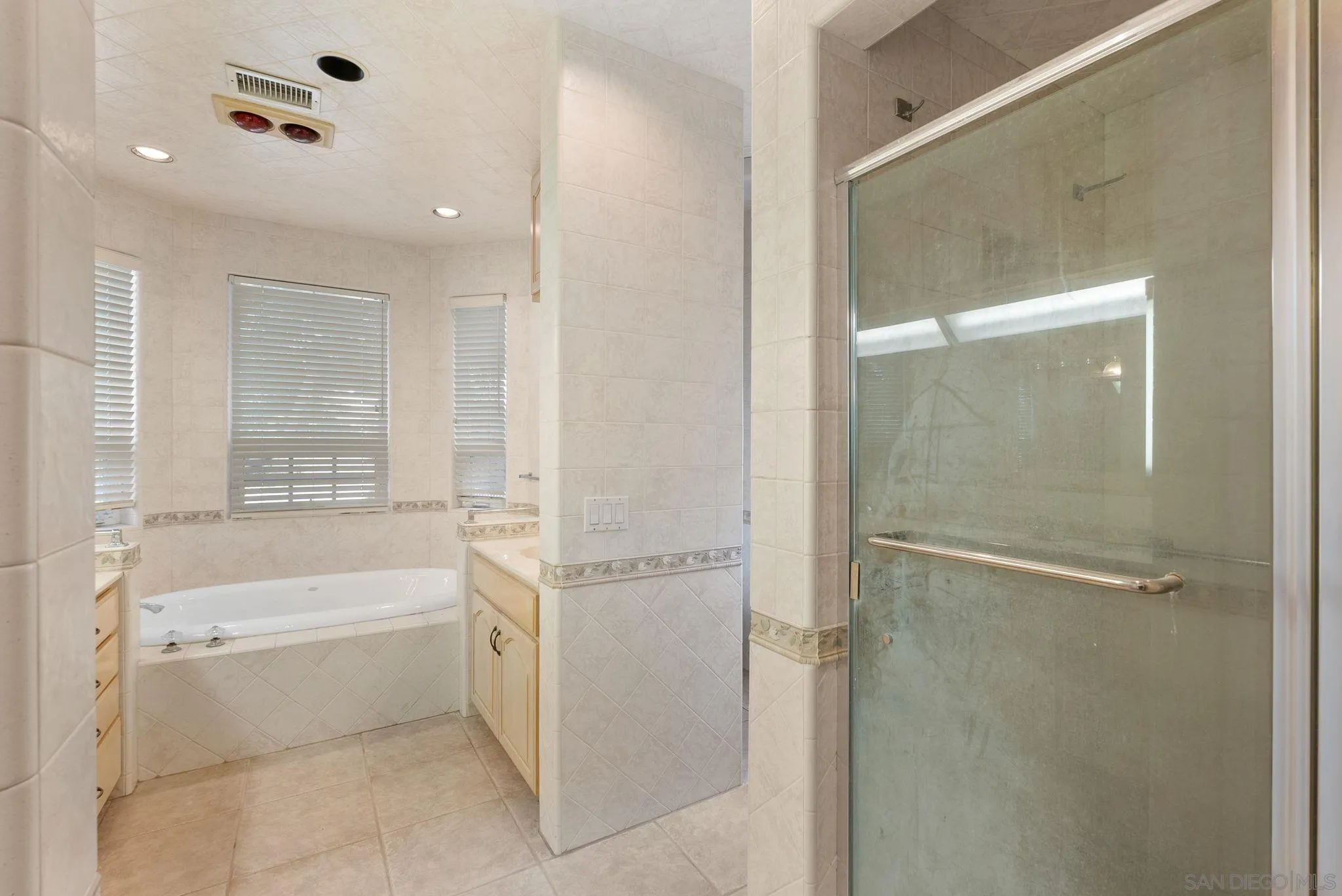 1807 Laurel Road Oceanside, CA 92054 - Photo 50 of 67 a bathroom with a bathtub and a shower