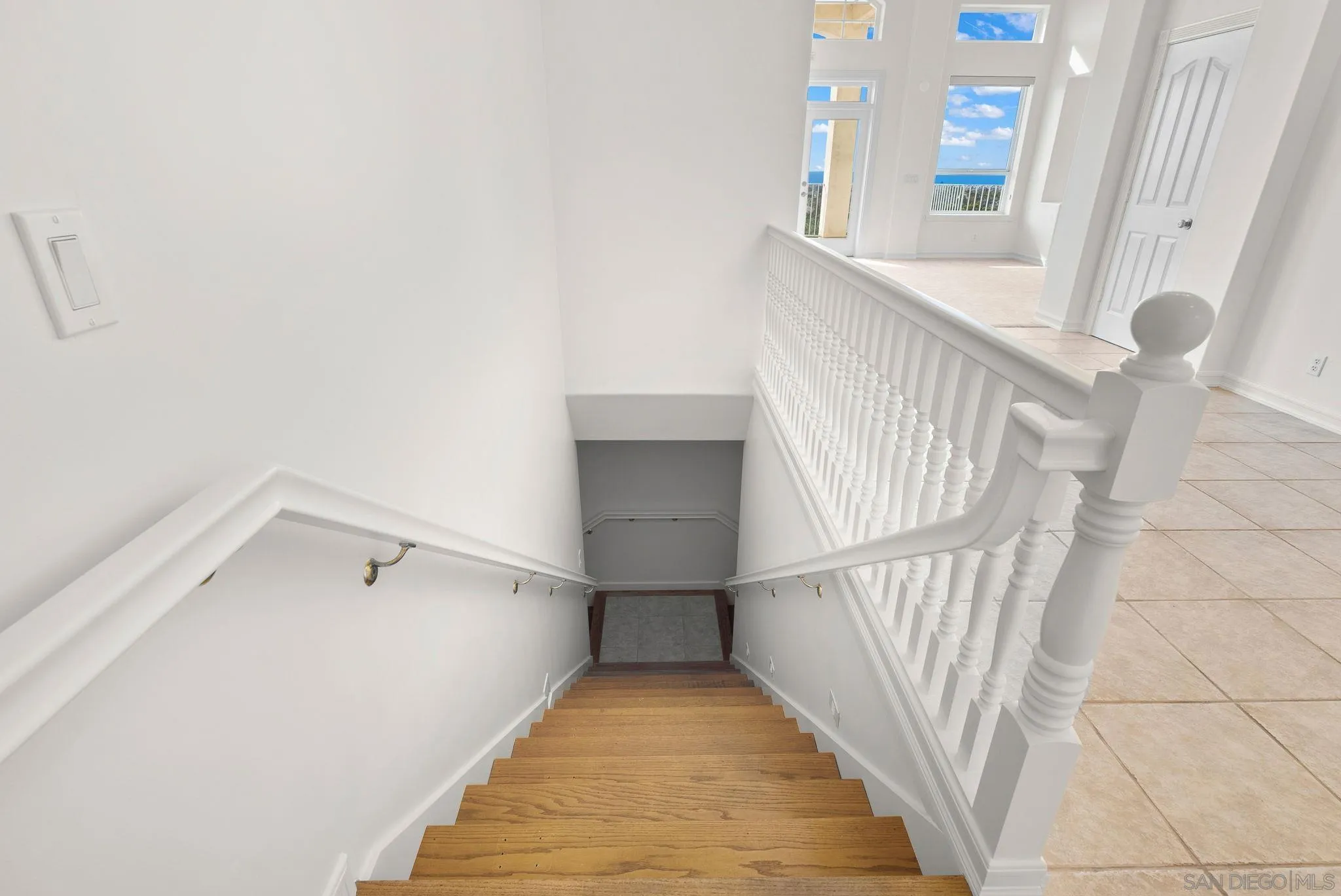 1807 Laurel Road Oceanside, CA 92054 - Photo 57 of 67 a view of staircase with white walls and a window