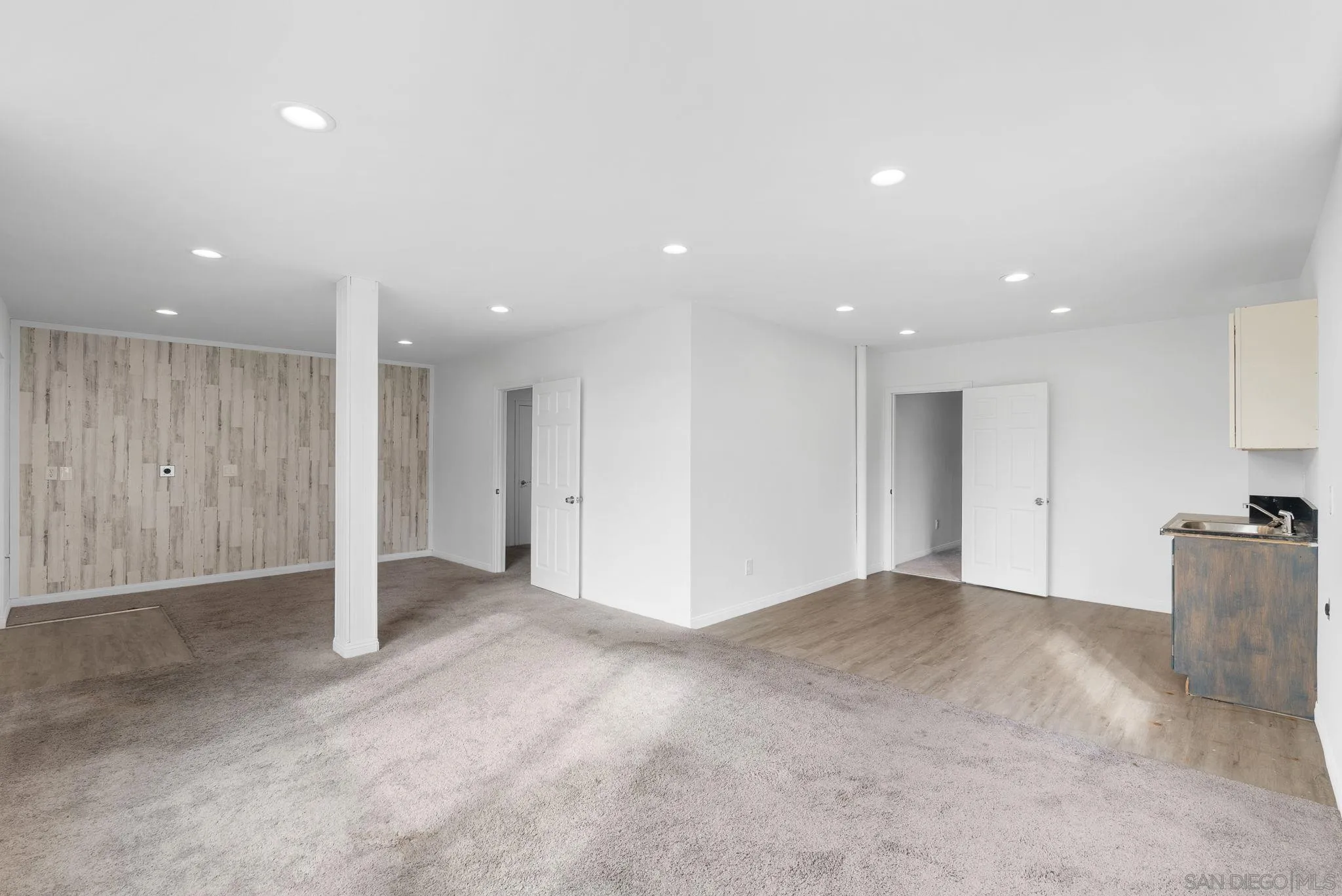 1807 Laurel Road Oceanside, CA 92054 - Photo 60 of 67 a view of an empty room with wooden floor