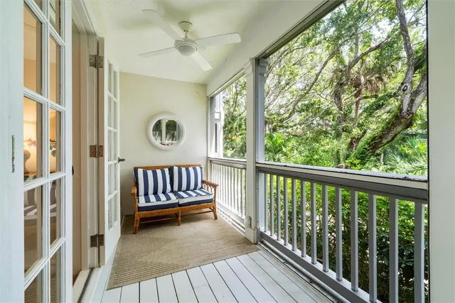 an aerial view of a house with a garden and lake view