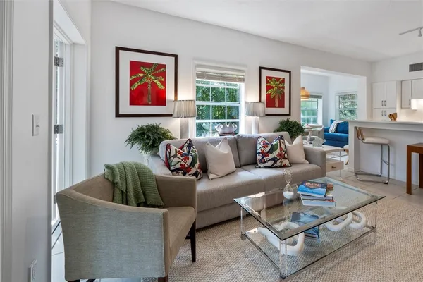 a living room with furniture and a large window