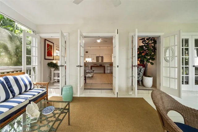 a living room with furniture potted plant and a window