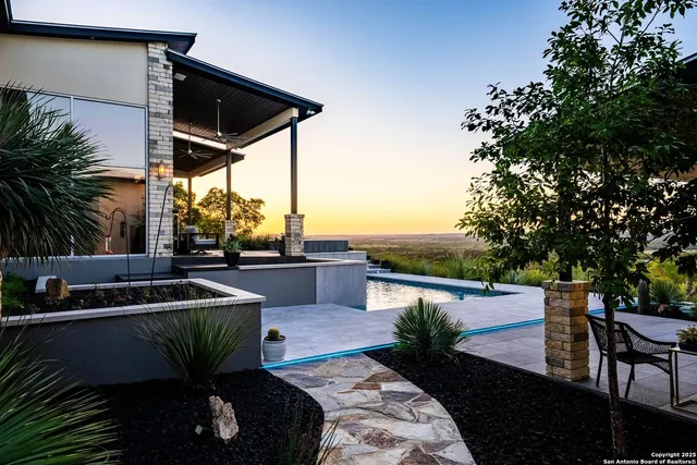 a view of a terrace with couches and potted plants